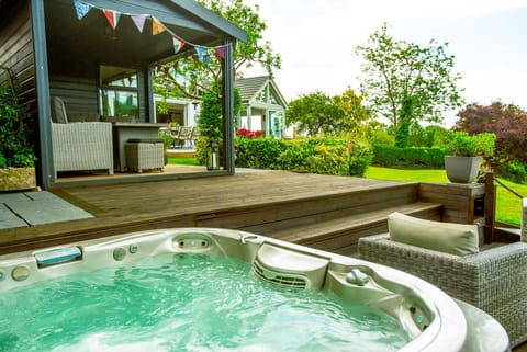 Hot tub area by Summer House and outdoor seating terrace