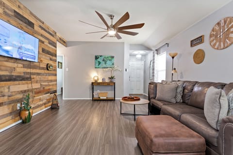 Added a leather chair to the living room; there're 2 ottomans (photo showing 1).