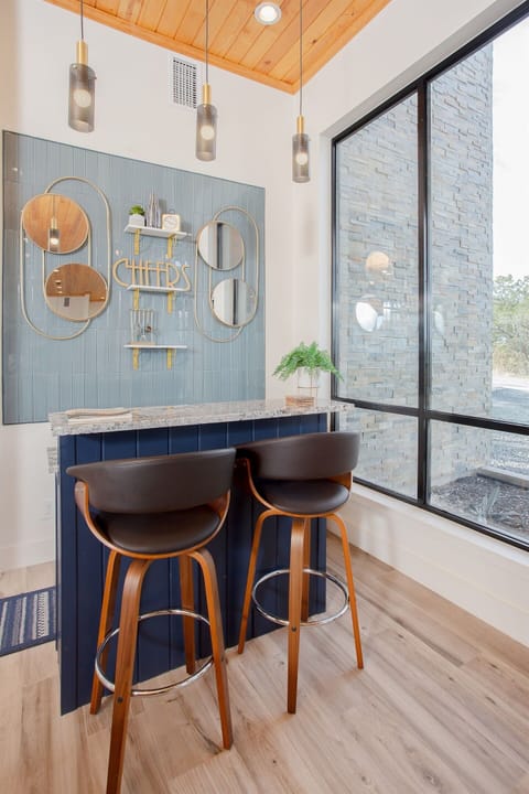 Lots of good times are had at the bar, which is fully stocked with glassware and barware tools.