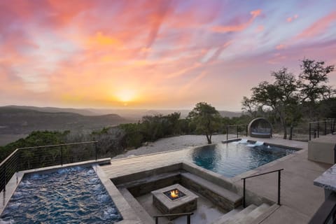 Backyard oasis with stunning sunrises, huge 20+ person hot tub, and infinity pool overlooking the hills.