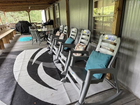 5 rocking chairs, table chairs, new grill for guests while enjoying the view.