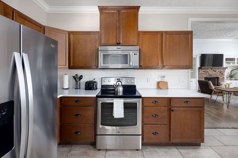 View standing at the sink, highlighting countertops and appliances