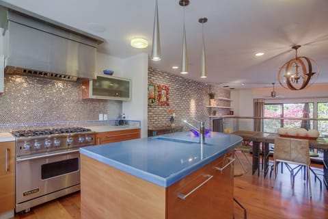 Special lighting surrounds the kitchen and dining areas.