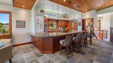 Kitchen with half bath & condo entry in the background
