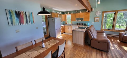 Open kichen/living room, over looking 
Torch Lake.