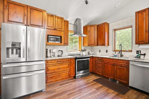 Kitchen: Stainless steel appliances, drip coffee maker, Keurig, Crockpot, cooking utensils, tableware