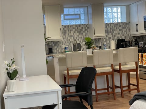 Note Kitchen block glass windows with ample natural light.