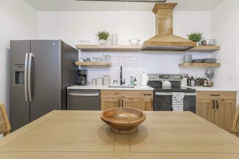 Our beautifully designed dining room features a large table that can accommodate your entire group.