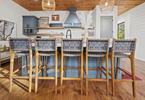 Kickstart your vacation days at our cozy kitchen bar, where style meets comfort at the heart of the home.