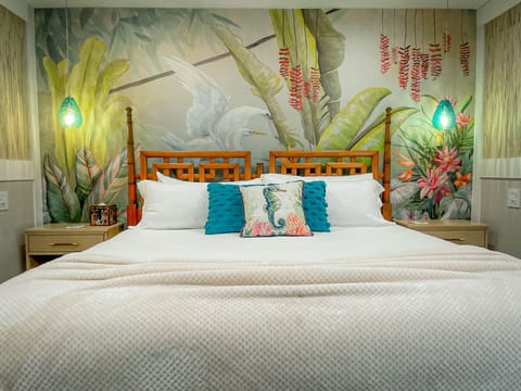 Master bedroom with King sized bed, large smart TV and en-suite bathroom. 