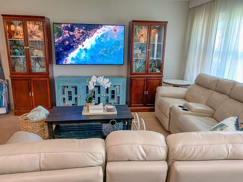 The living room has a large 65" smart tv with full premium Xfinity cable.