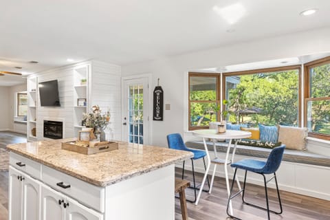 Newly renovated kitchen with a lot of natural light and additional dining space