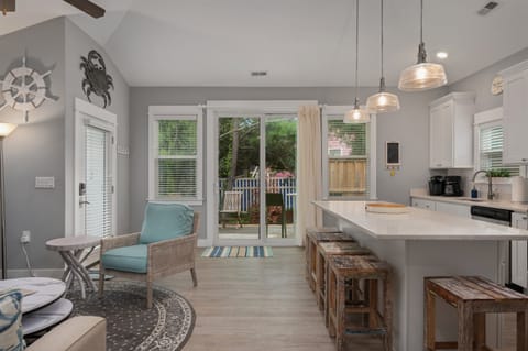 Big sliding door for direct access to the backyard seating and hot tub
