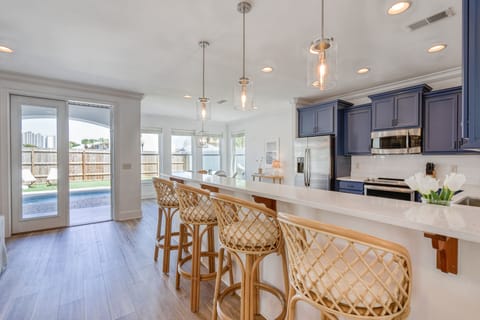 Additional seating at the kitchen counter.