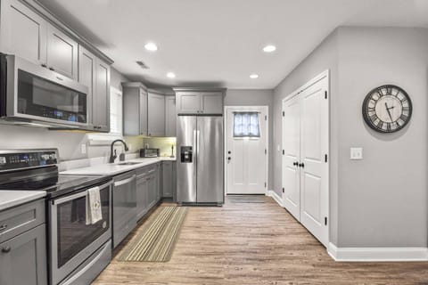 Kitchen opens up to deck and backyard