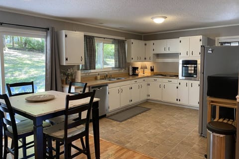 Ample counter space for food prep and lots of natural light from the double window over the sink.