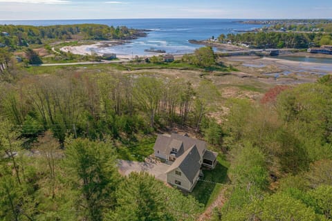 Surrounded by mature trees within steps to the beach. 