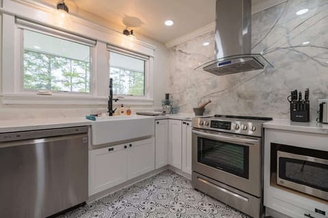 Kitchen is thoughtfully stocked with spices, cookware, and all the essentials you may need to feel right at home while preparing your favorite meals.