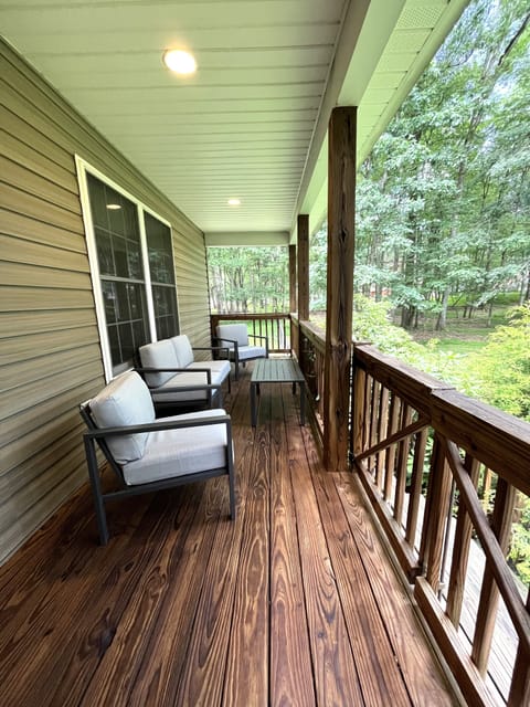 The side porch that leads to the fenced-in dog area. 
