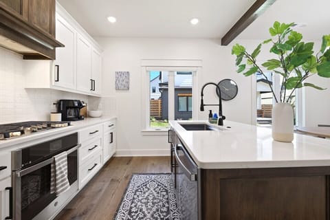 This space is fully stocked with state-of-the-art amenities and appliances, including a gas stove, combination Keurig/drip coffee pot and plenty of built-in storage.