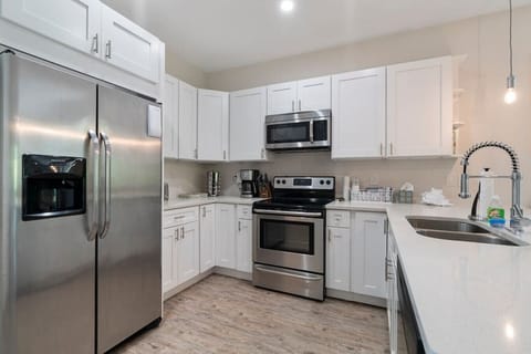 Clean and sleek kitchen with stainless appliances