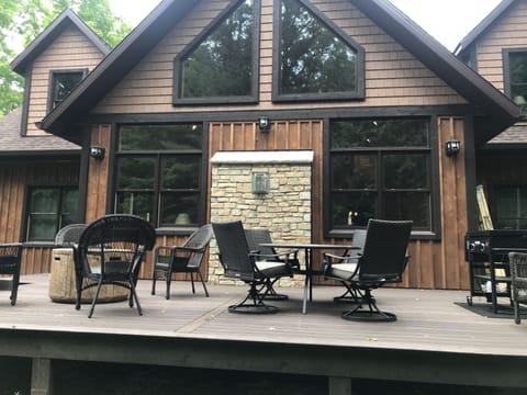 Back of home privacy with large deck and woods. Door County stone