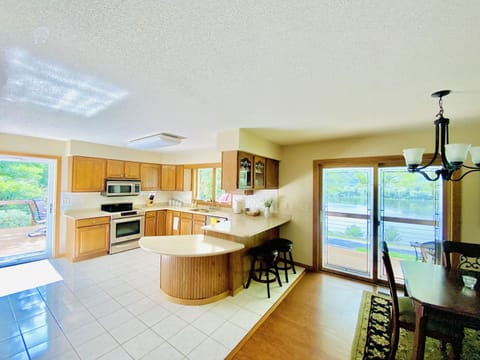 Bright upstairs kitchen with all cooking utensils