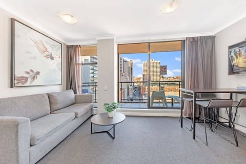 Living area with comfortable sofa seating, coffee table, dining space, and a sofa bed for additional sleeping accommodation.