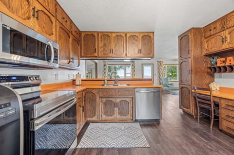The spacious kitchen is perfect for cooking with ample counter space. 