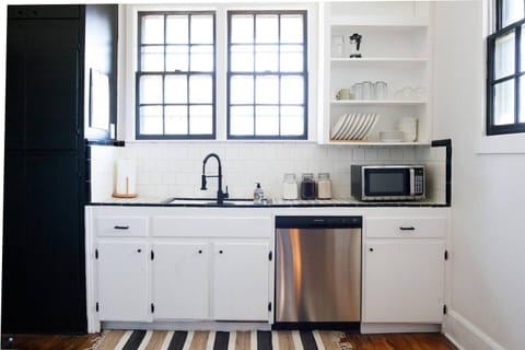 You'll love cooking again in this black and white themed kitchen