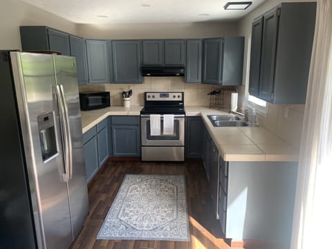 Fully equipped kitchen that overlooks the deck and lake.