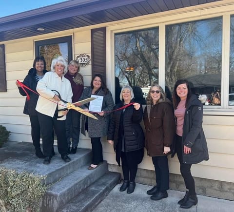 Chamber of commerce ribbon cutting ceremony with owner, Diane Flynn