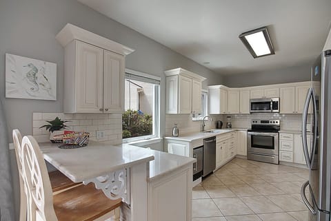 The gourmet kitchen has all the cooking tools & small appliances for meal prep