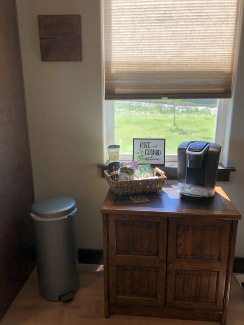 Fully stocked coffee bar with Keurig coffee maker. 