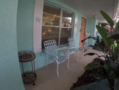 Front sitting area have your morning coffee while you enjoy the tropical scape