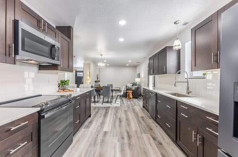 Galley Kitchen with New Appliances
Well supplied for cooking, & eating together.