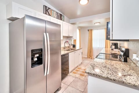 The kitchen features a spacious cabinet that allows for excellent food storage