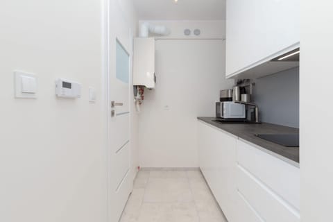 The fully equipped kitchenette includes everything you need for a home-cooked meal.