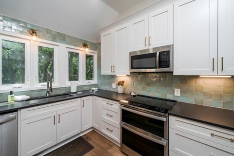 Stunning tiled walls and loads of windows letting in the light