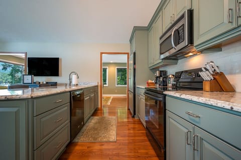 Kitchen is outfitted w/ Electric Smooth-top Range