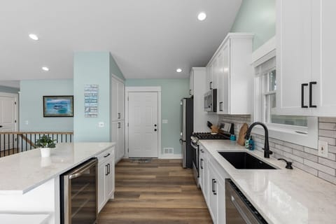 Brand new kitchen, island with seating for 4 and a beverage cooler