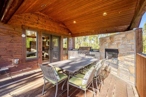 Upper deck with ample sitting area, gas fireplace and gas grill.