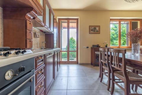 Cabinetry, Furniture, Property, Countertop, Gas Stove, Table, Window, Wood, Interior Design, Cooktop