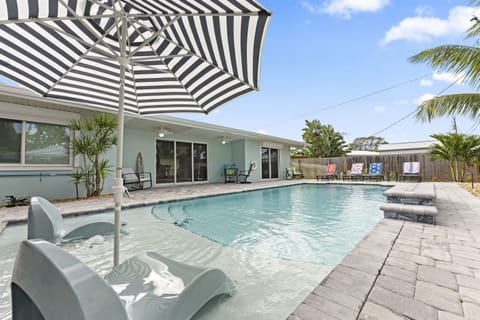 Amazing heated saltwater pool with waterfall and sun shelf