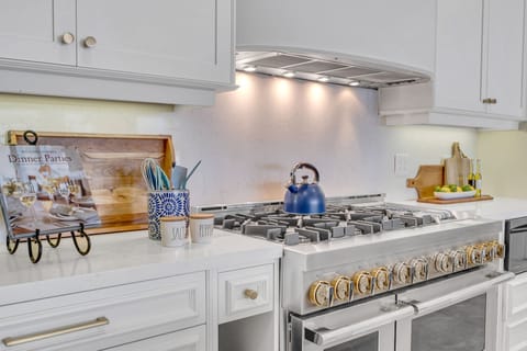 The kitchen is a chef's dream with plenty of space for cooking and preparation featuring incredible views of the inlet.
