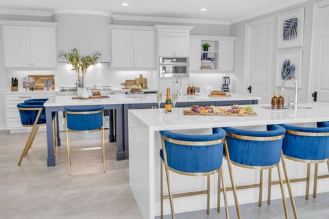 The kitchen is a chef's dream with plenty of space for cooking and preparation with plenty of seating space.