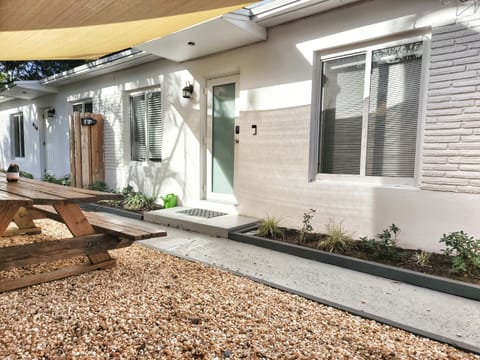 front door entrance with bonus picnic table for hanging out