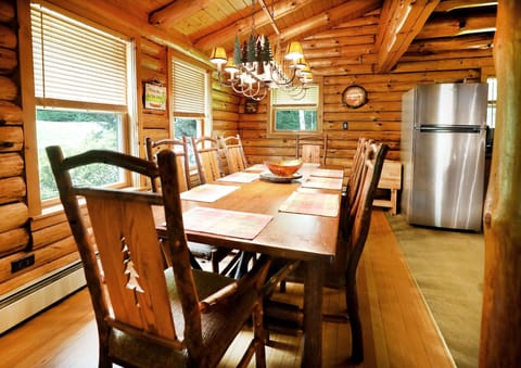 Our intricate metal chandelier adds that Adirondack feel to the dinette area