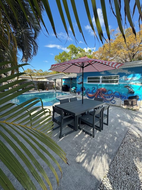 Backyard oasis livened by mural painted from local artist.