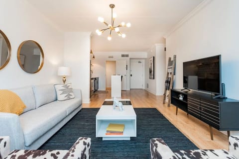 Living room with a Queen pullout couch. Smart TV with with YouTube TV for cable. Queen air mattress also available. Plenty of seating plus a couple board games!